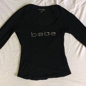 low-cut three-quater sleeve bebe shirt.